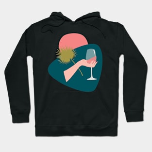 Hand with a glass of rose wine and leaf Hoodie